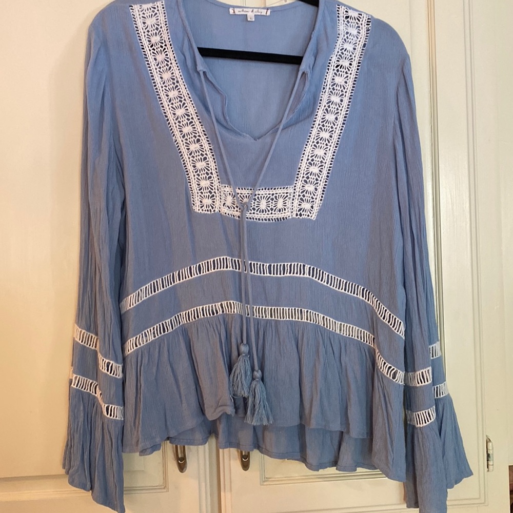 Pretty blue muslin type fabric with lace inserts. Size L